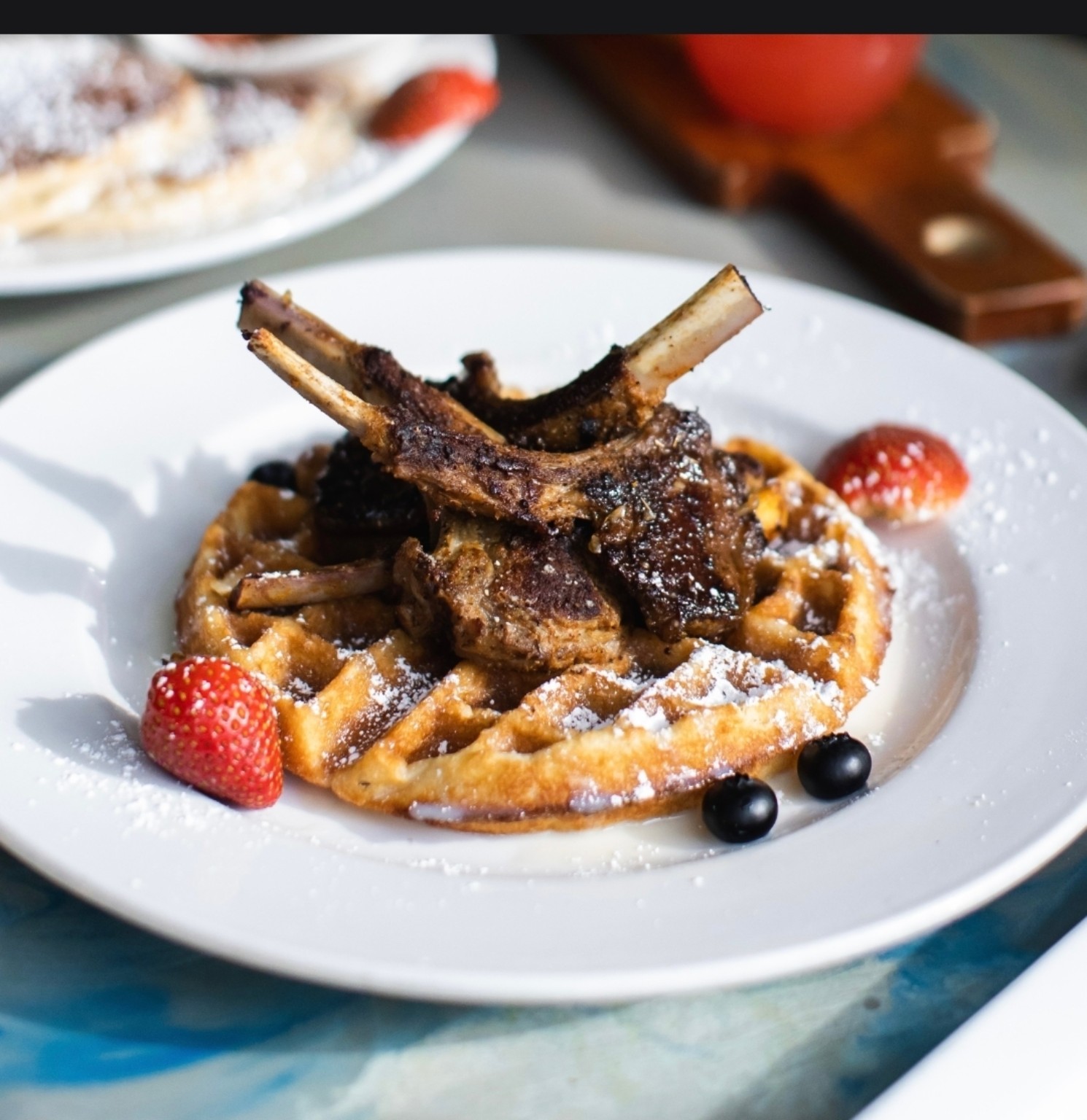 Lamb chops and waffles at The Riviere
